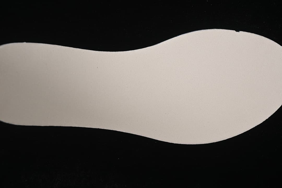 Underside of the shoe's light-colored insole.