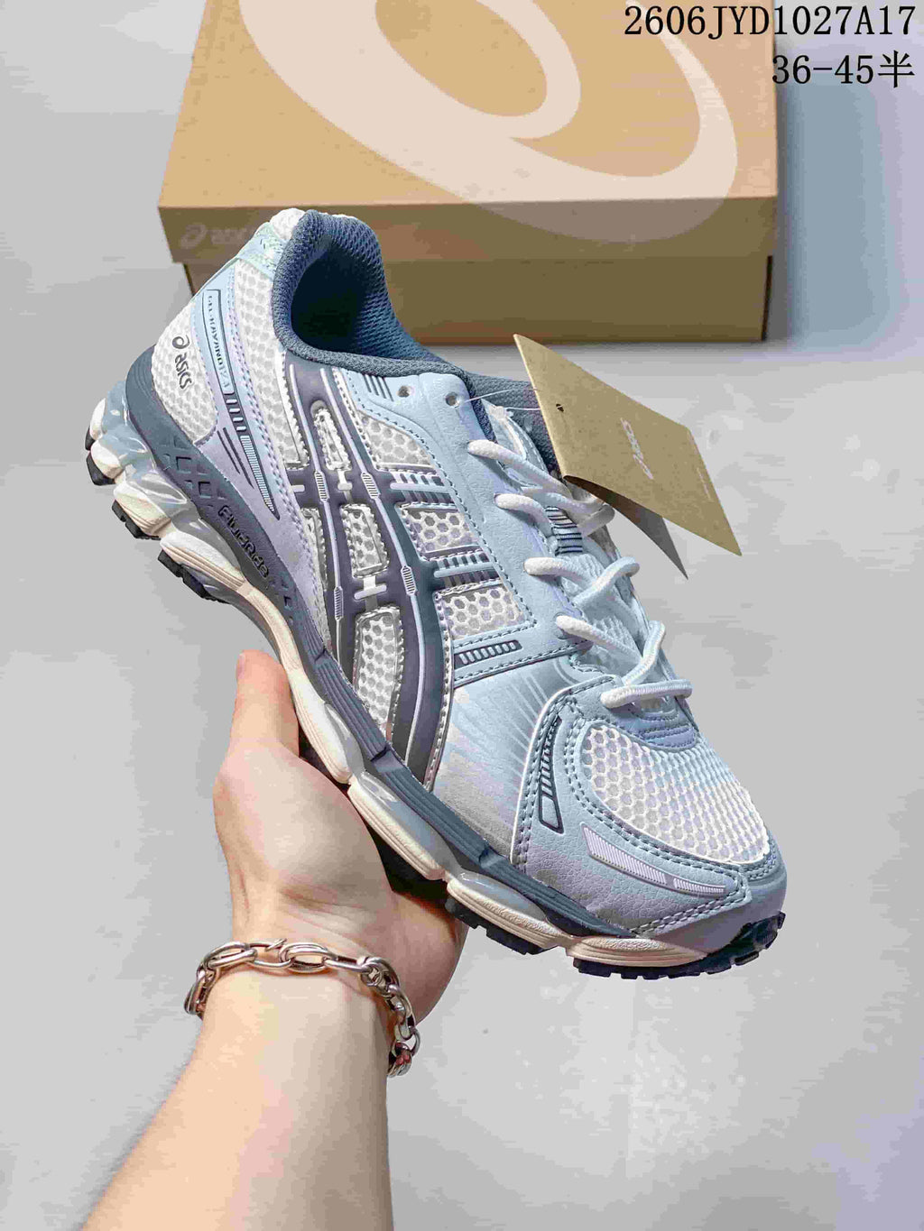 White and silver ASICS GEL-KAYANO 12.1 sneaker with burgundy accents