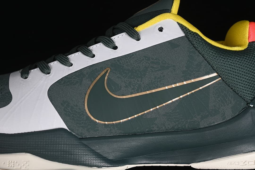 Close-up of the dark green side panel and metallic-toned Swoosh