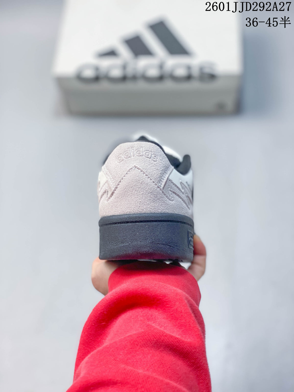 Rear view of an Adidas Wcard Adv sneaker with a light gray heel and dark outsole