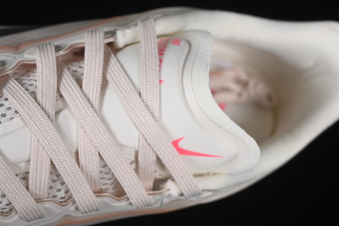 Close-up of the laces, tongue, and pink Swoosh detail