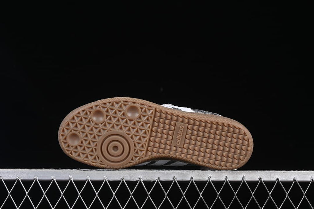 Underside view of the gum-colored outsole with patterned tread