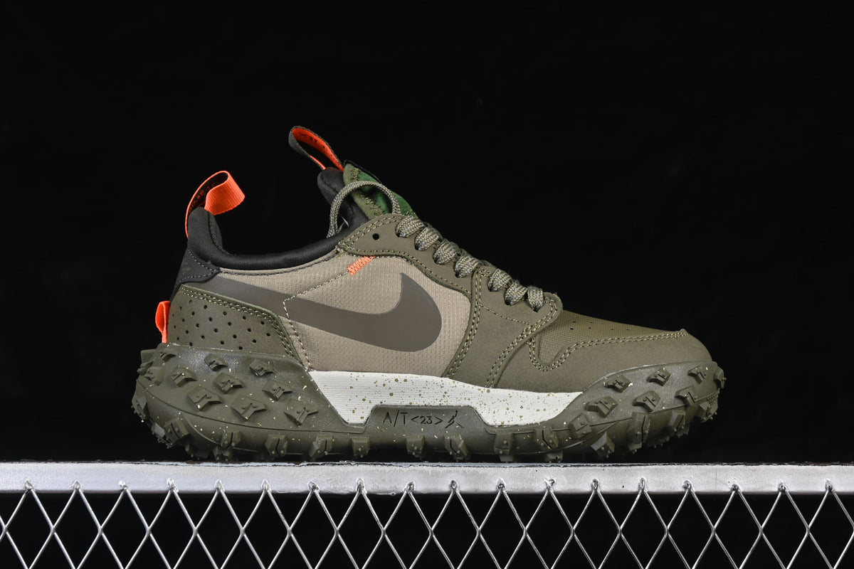 Side profile of one olive sneaker with a gray Swoosh and rugged tread.