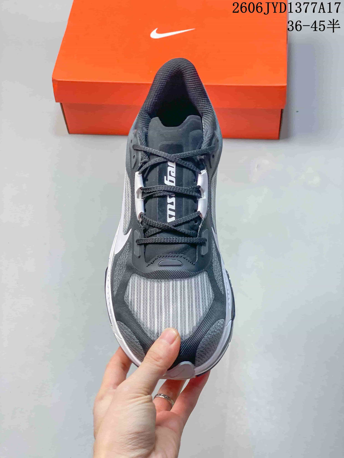 Top view of the charcoal lace-up sneaker with a light gray striped toe panel