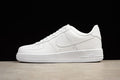 White low-top Nike Air Force 1 sneaker shown in profile against a black background.