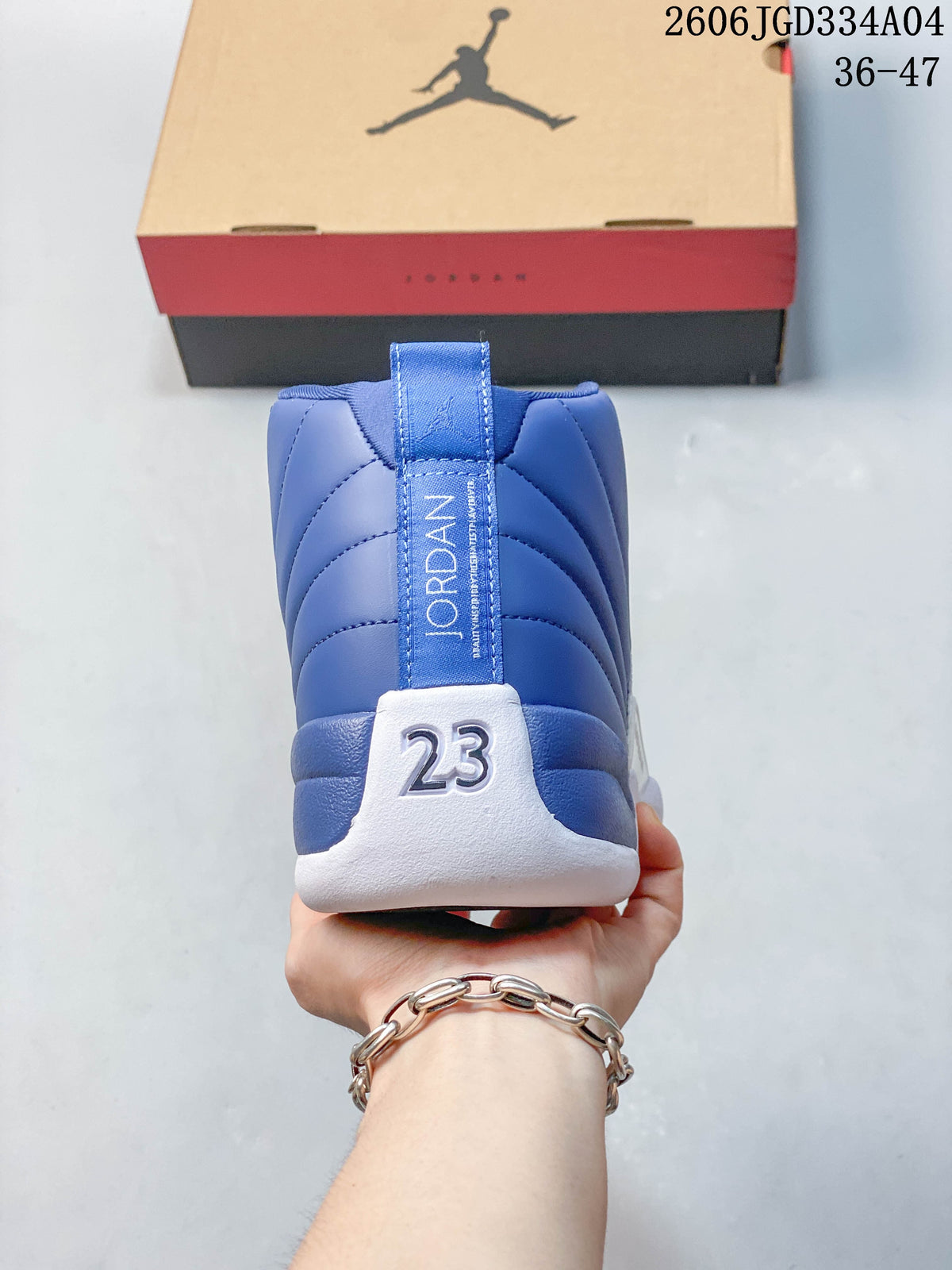 Rear view of a blue and white Jordan Air Jordan 12 with a 23 detail