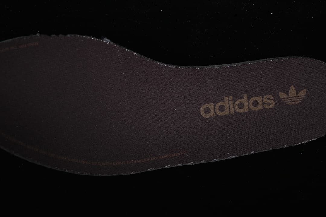 Close-up of the dark adidas-branded insole.