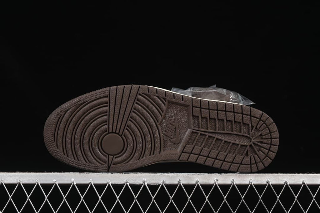 Underside view of the dark brown tread