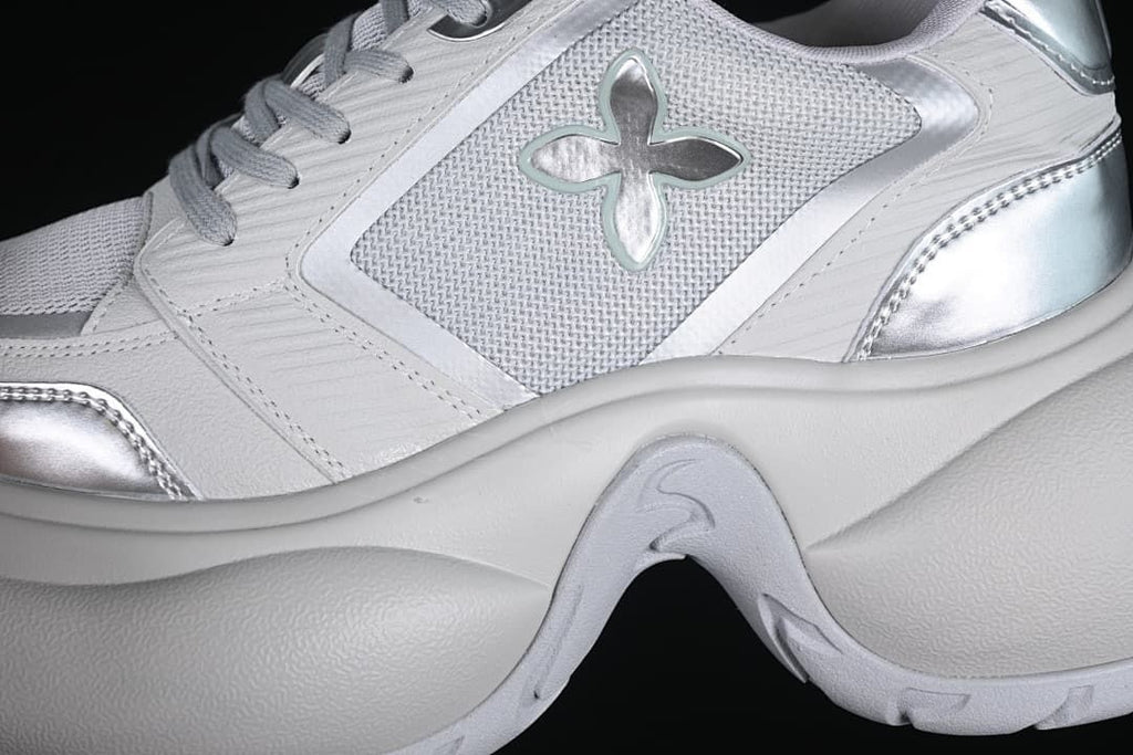 Close-up of the side emblem, mesh-look panel, and layered sole