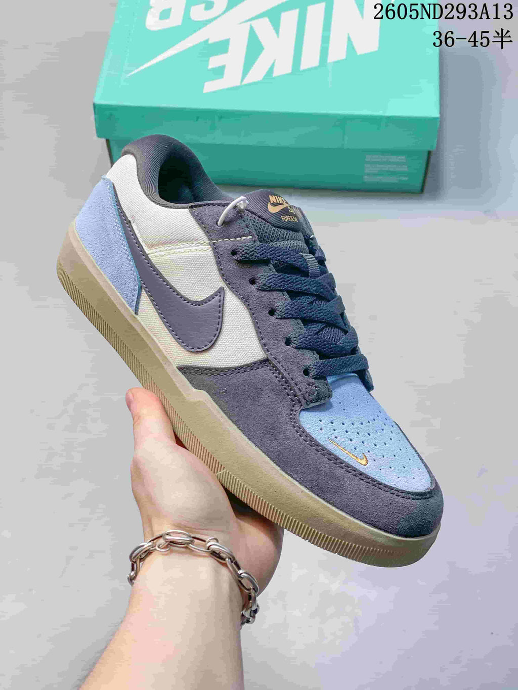 Angled side view of a blue, gray, and off-white Nike SB Force 58 low-top shoe