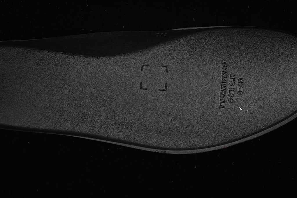 Close-up of the dark insole with embossed markings
