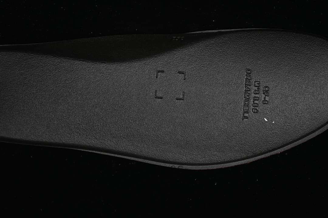 Close-up of the dark insole with embossed markings