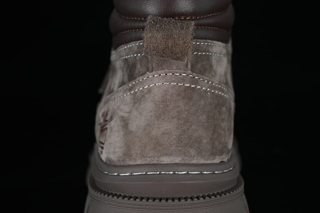 Rear view showing the boot heel, padded collar, and pull tab