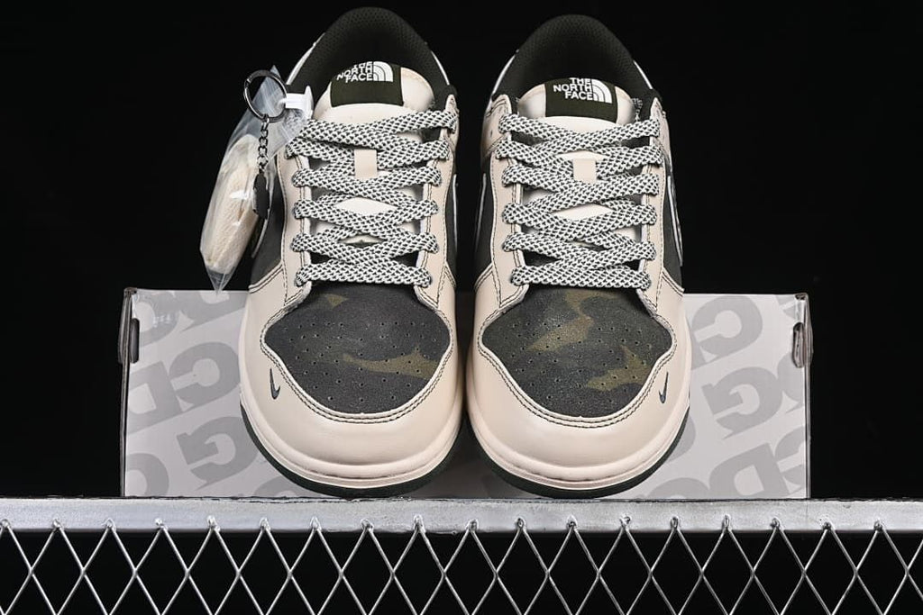 Front view of the pair showing patterned laces and camouflage toe panels