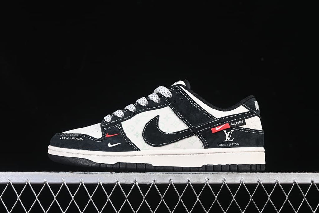 Side view of black and white low-top sneakers with patterned panels and visible branding
