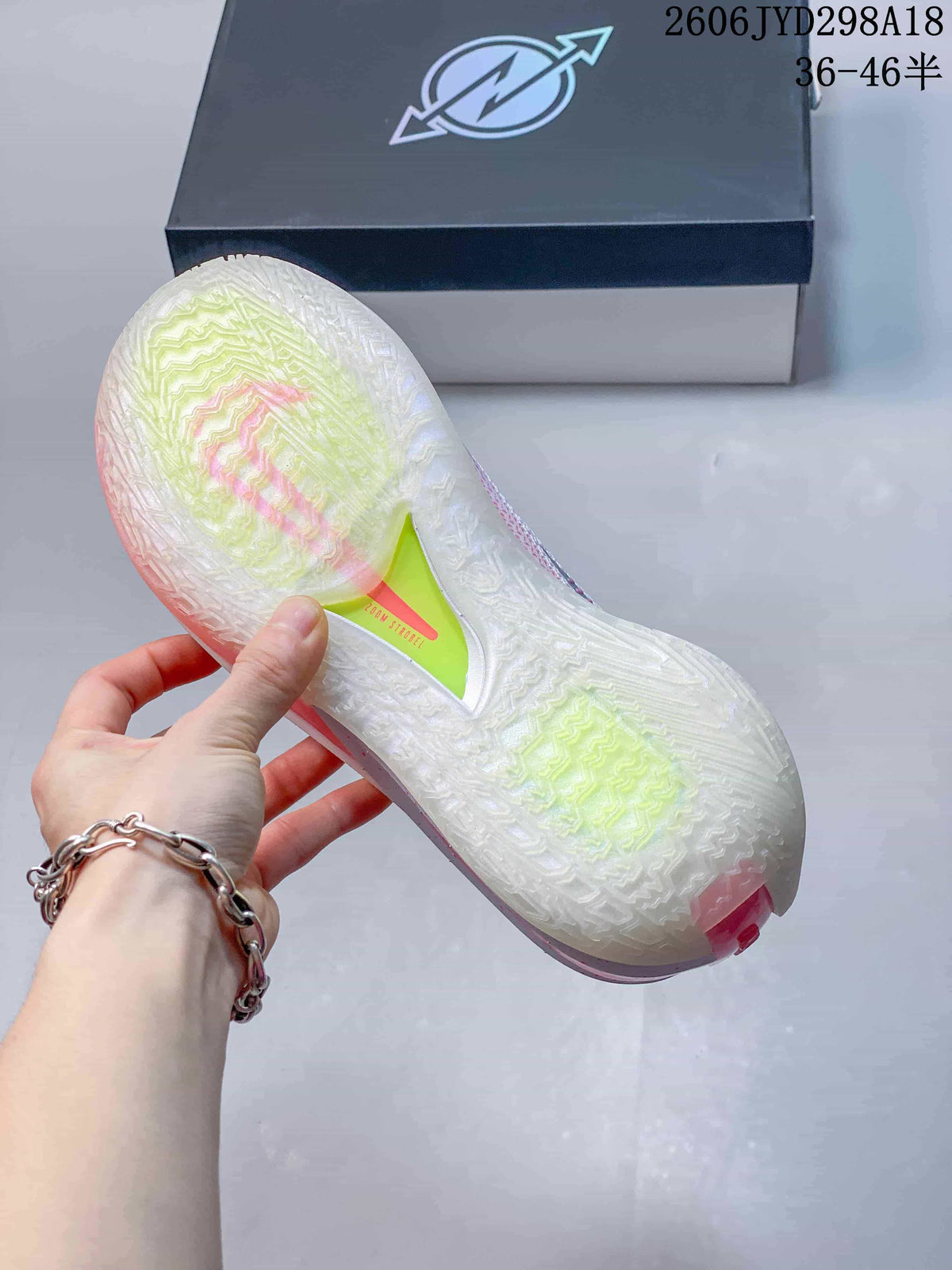 Close-up of the shoe’s translucent-looking outsole with colored details.