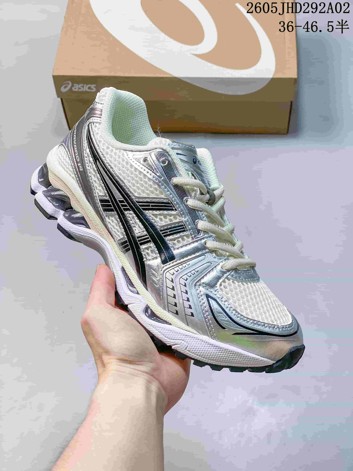 ASICS GEL-KAYANO 14 sneaker in white and silver with dark accents