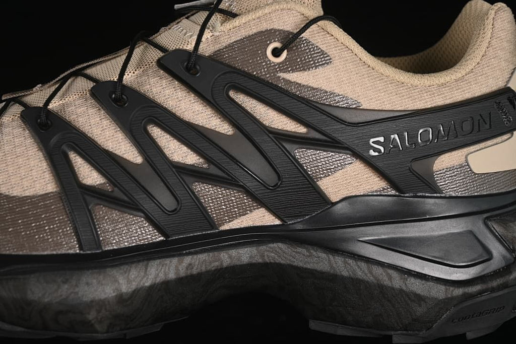 Close-up of the black side cage and Salomon branding.