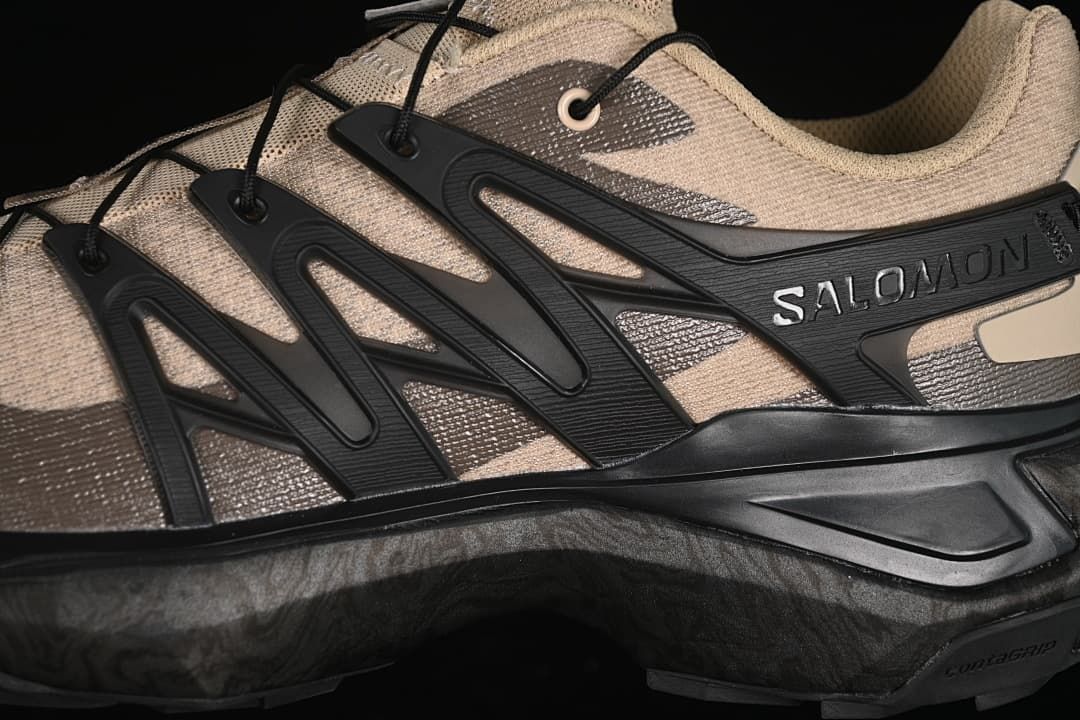 Close-up of the black side cage and Salomon branding.