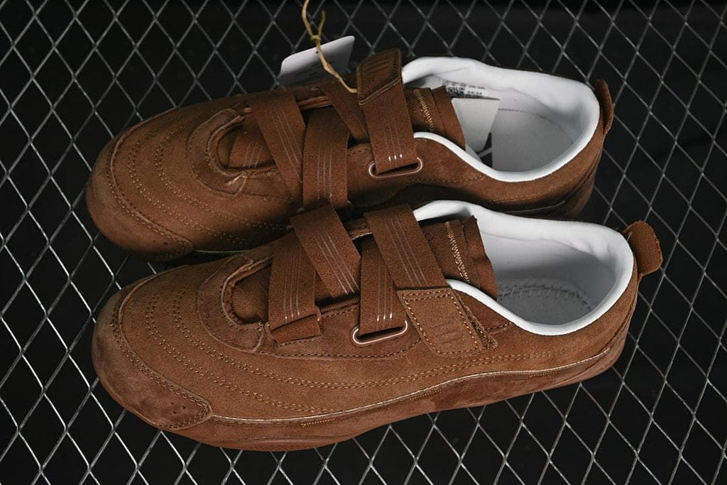 Pair of brown strap sneakers viewed from above