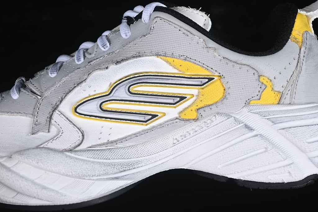 Close-up of the side logo, grey panels and yellow accents