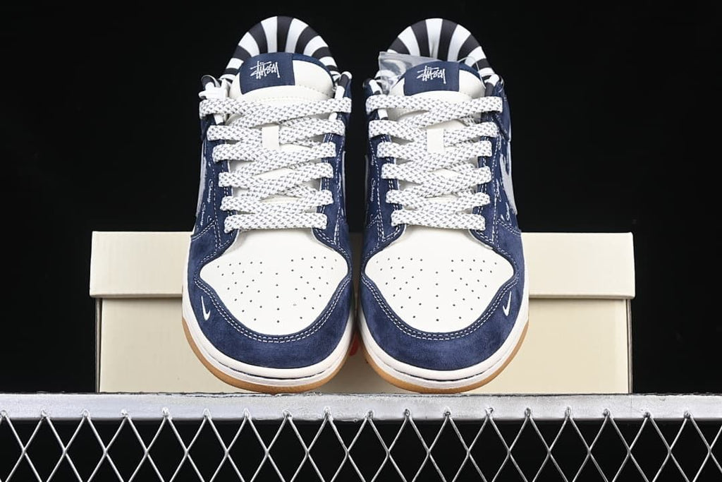 Front view of the pair showing the perforated toe boxes and patterned laces