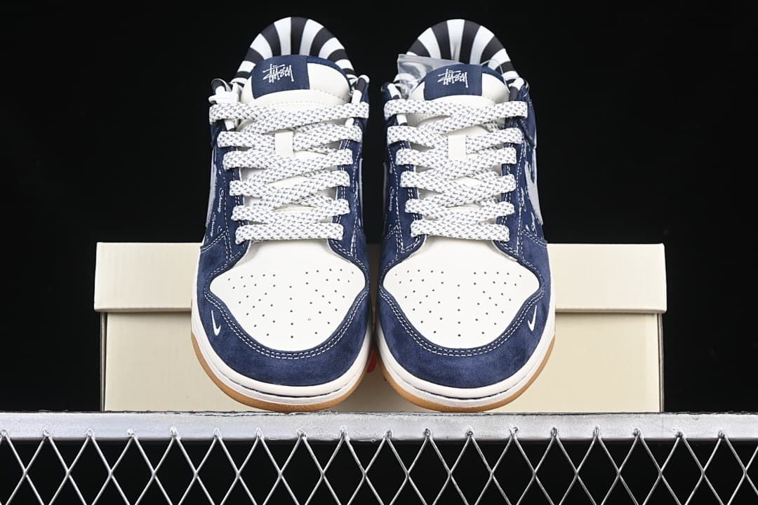 Front view of the pair showing the perforated toe boxes and patterned laces