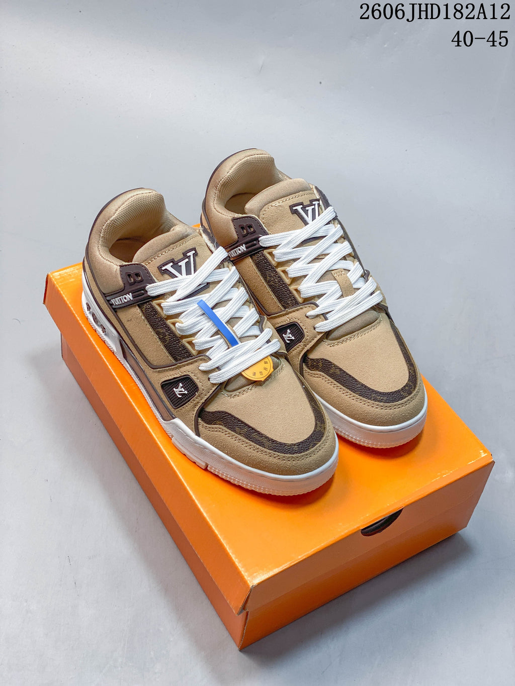 Pair of beige Louis Vuitton Trainer low-top sneakers with brown accents and white laces; image overlay reads 40–45.