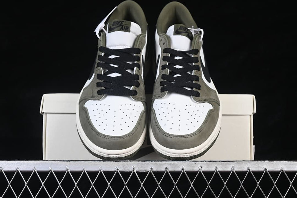 Front view of the pair showing the perforated toe boxes and laces