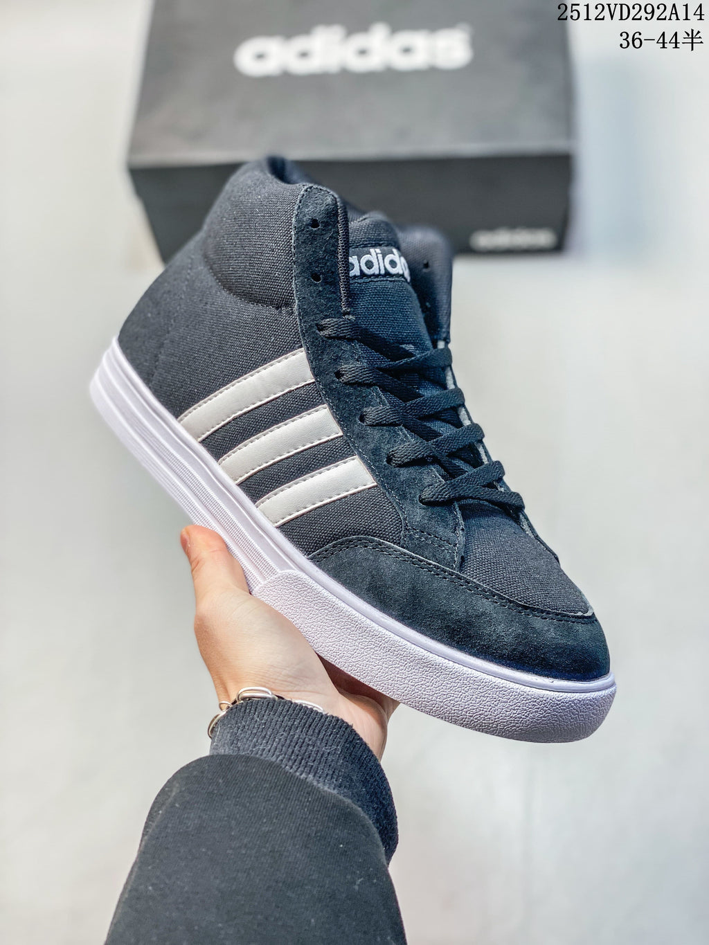 Angled side view of the navy Adidas high-top sneaker with white stripes and sole
