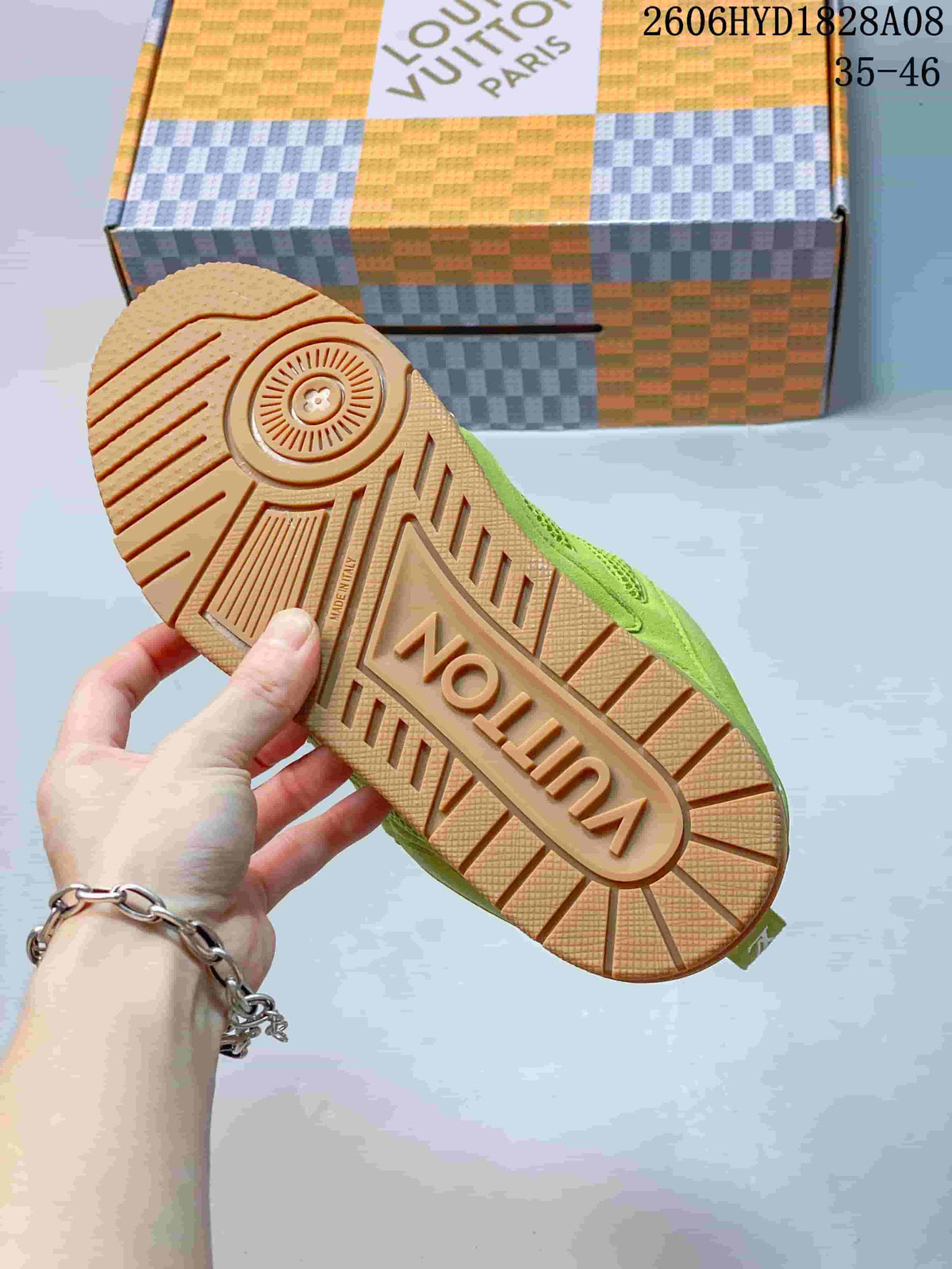 Underside of the sneaker showing a gum-colored tread pattern
