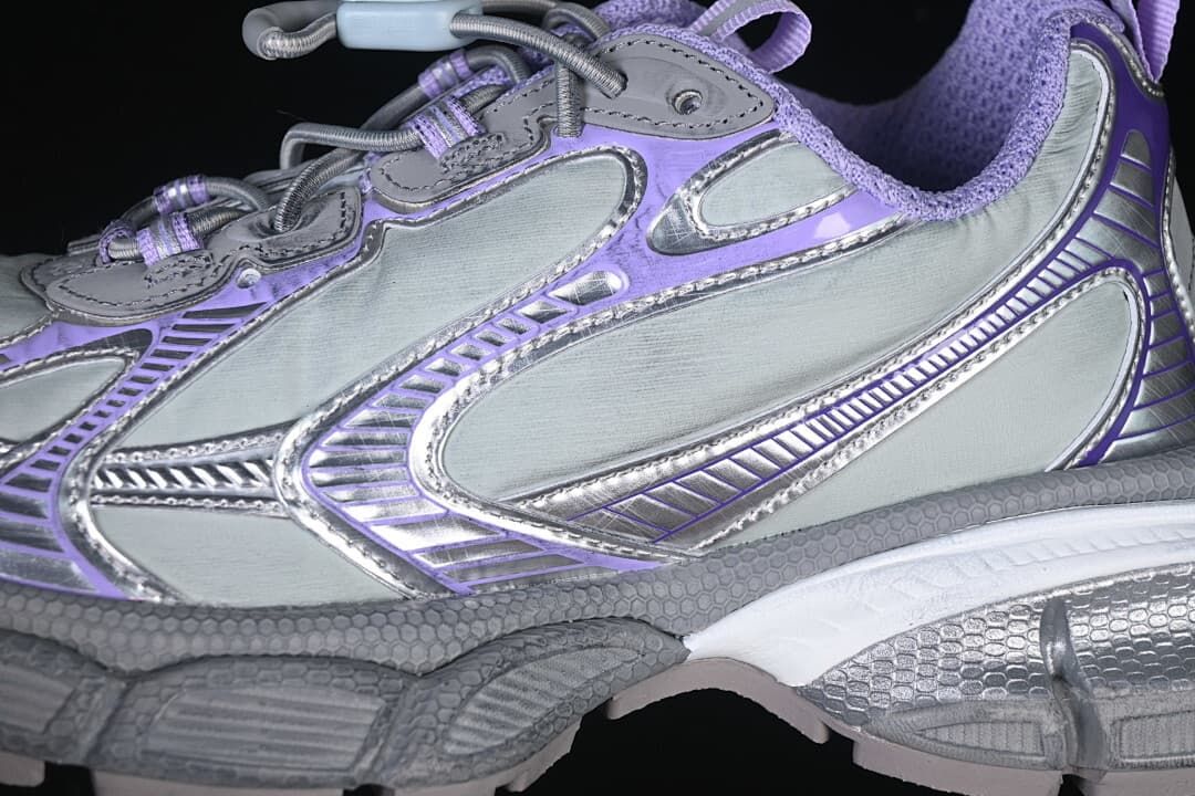 Close-up of the layered aqua, lilac and grey side panels