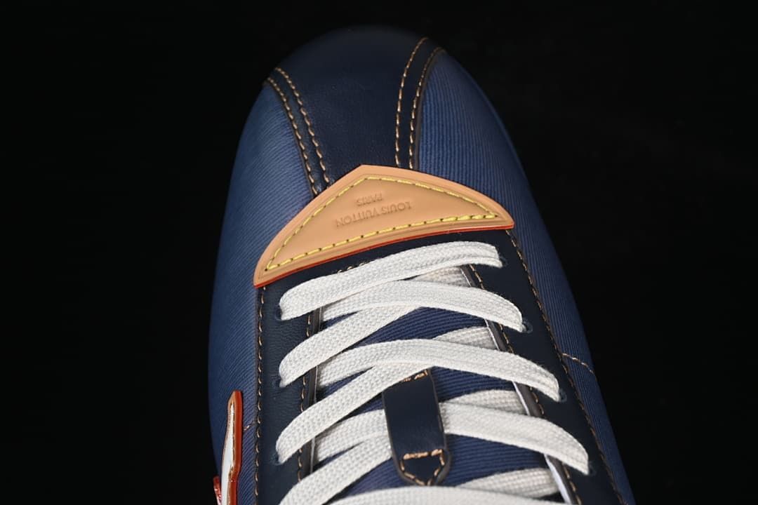 Top view of the sneaker’s laces and tan toe detail