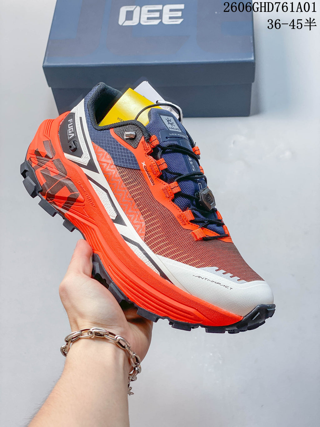 Angled side view of the rust-red and orange Kailas FUGA EX330 trail shoe