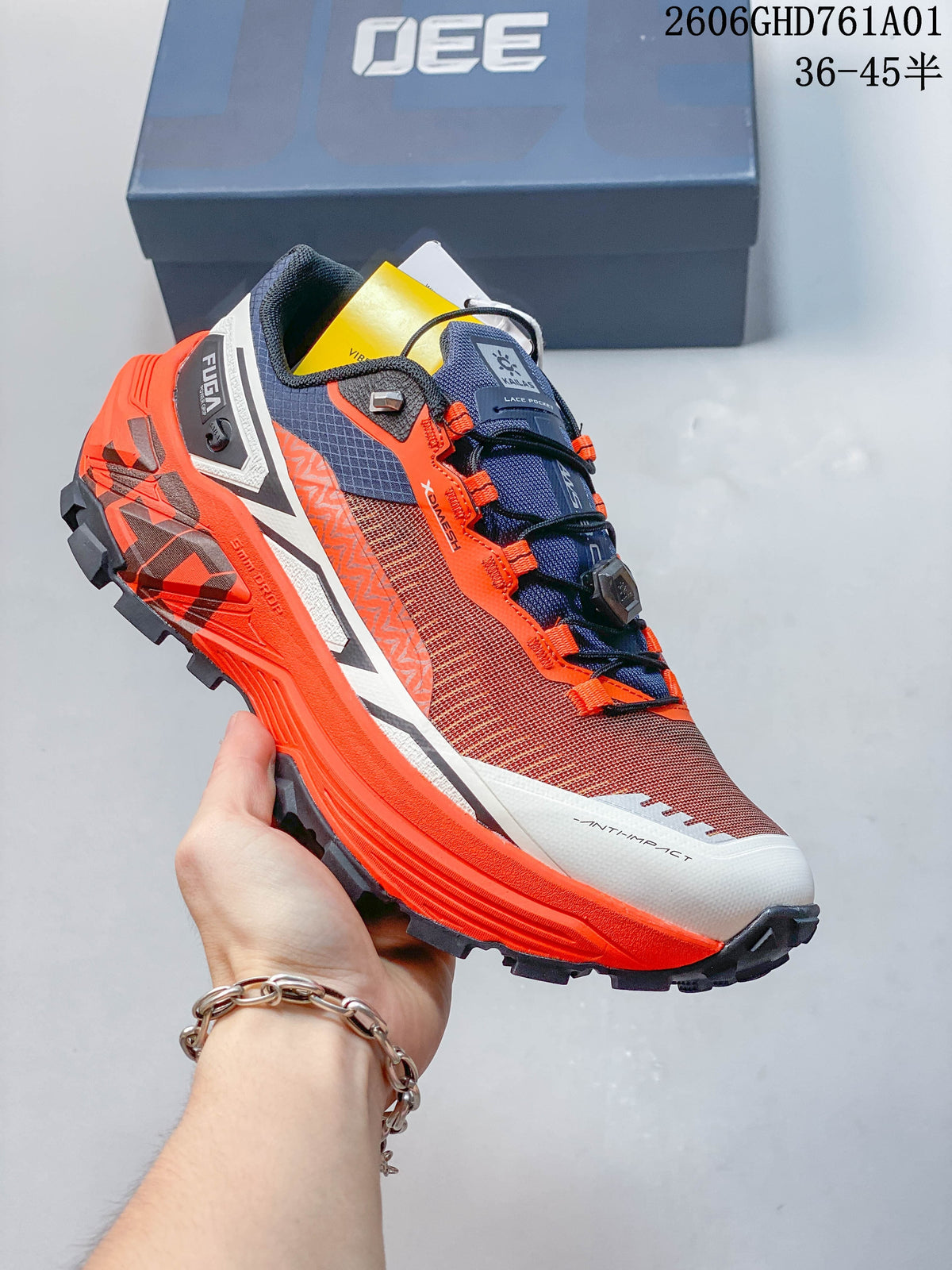 Angled side view of the rust-red and orange Kailas FUGA EX330 trail shoe