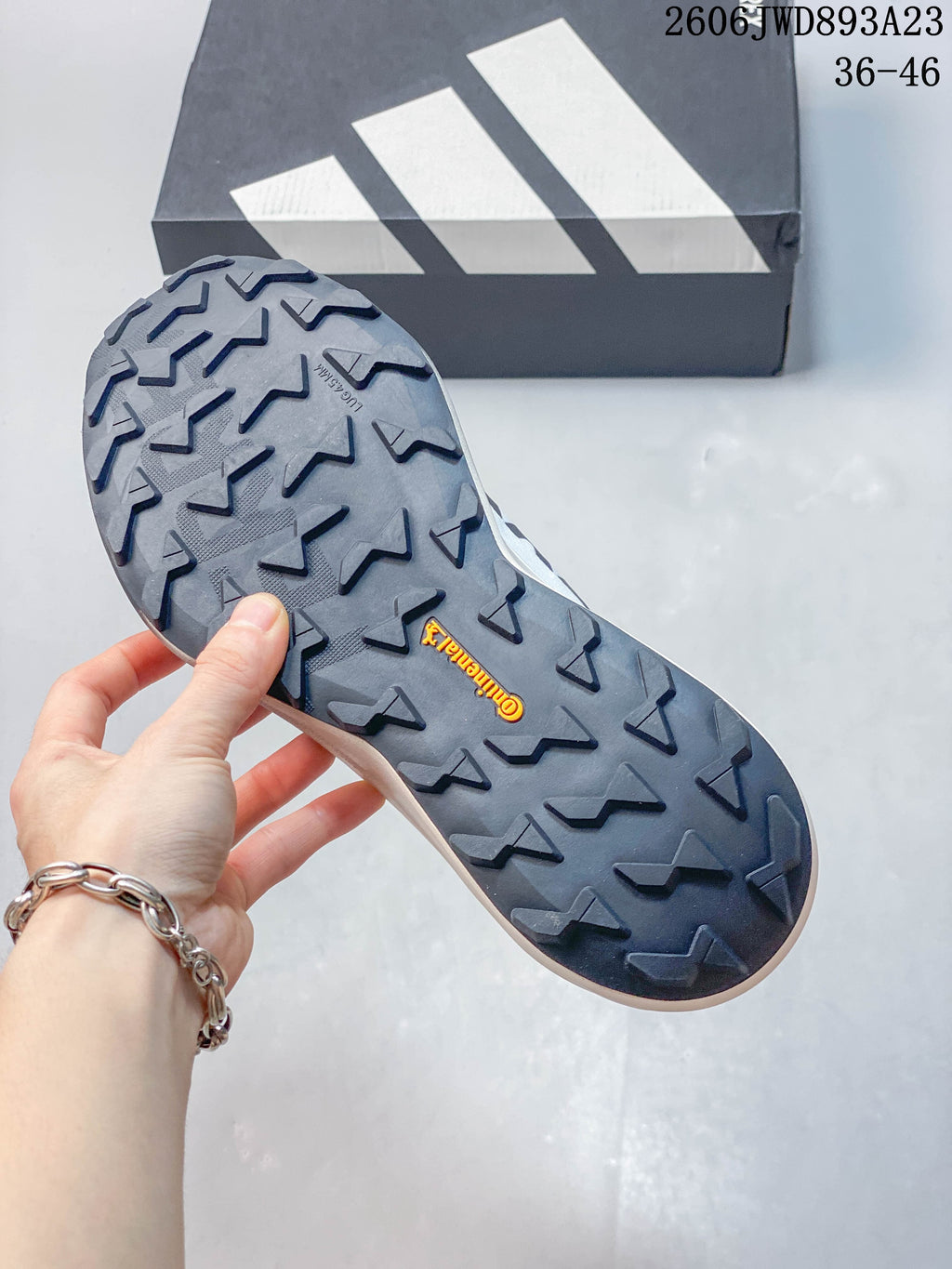 Close-up of the shoe's lugged outsole.