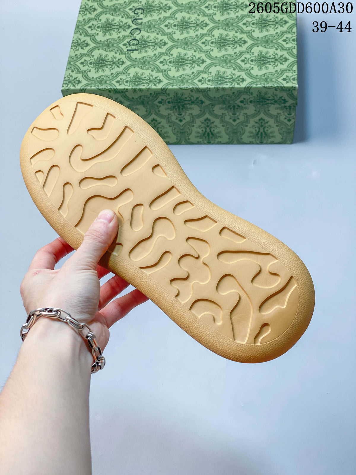 Gum-colored outsole with a molded tread pattern.