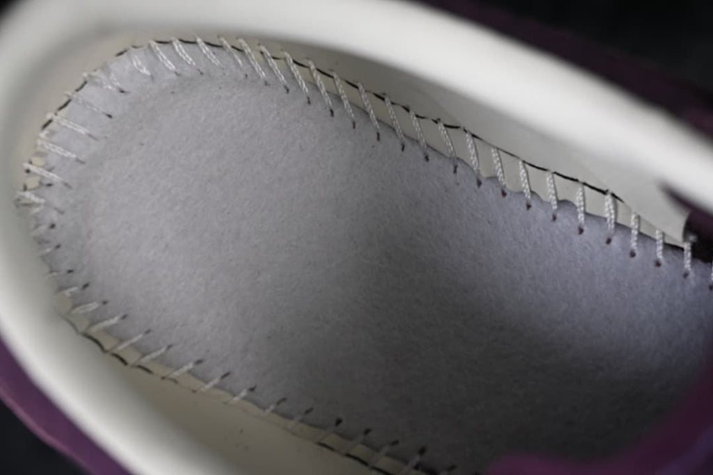 Close-up view inside the shoe showing stitched insole construction