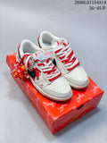 Pair of off-white Nike SB Dunk Low sneakers with horse graphics, red-and-white laces, and a red patterned shoe box