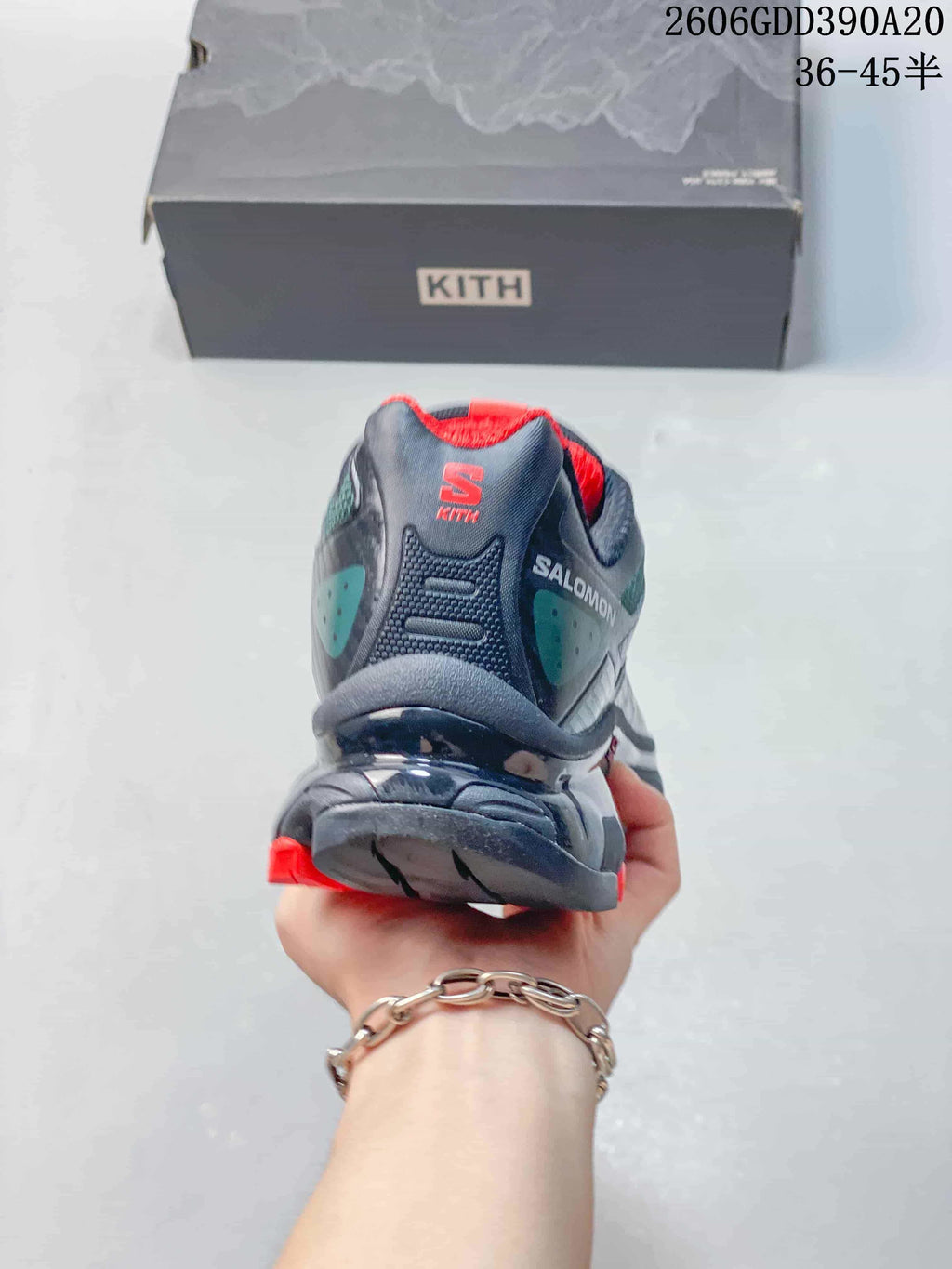 Rear view of a Salomon XT-4K shoe showing its heel design and red lining.