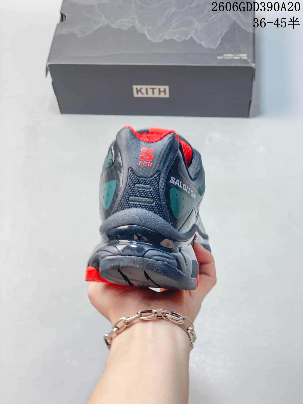 Rear view of a Salomon XT-4K shoe showing its heel design and red lining.