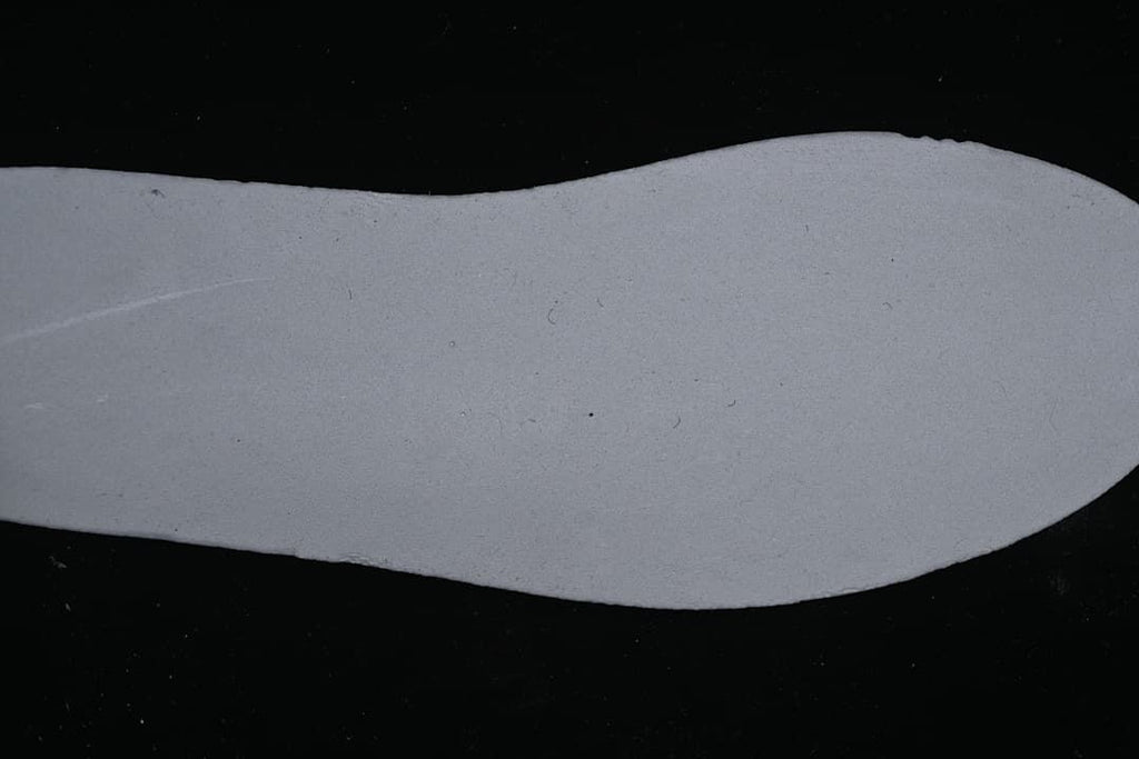 Light-colored shoe insert shown separately