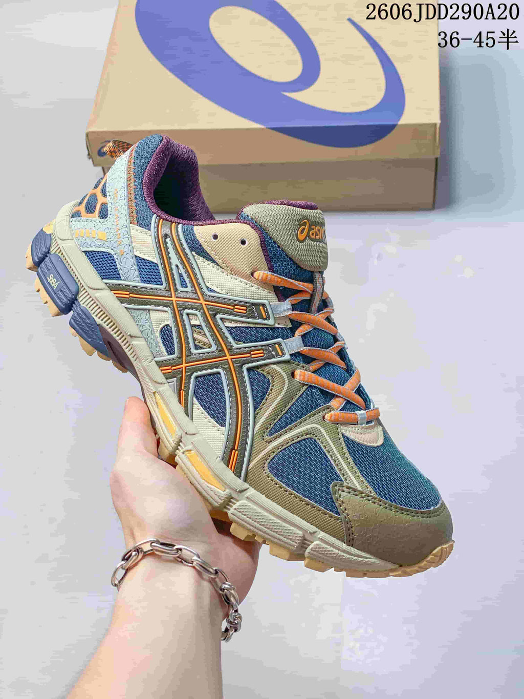 ASICS Gel-Kahana 8 sneaker in blue, khaki and orange accents.