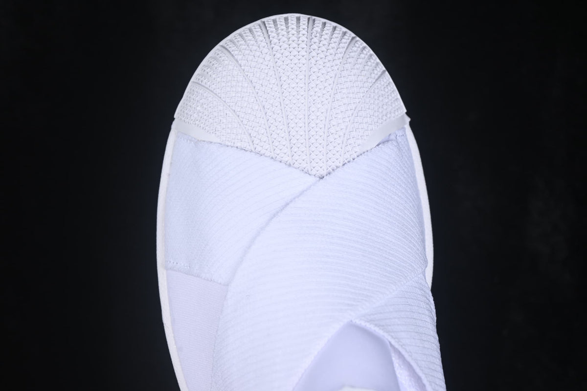 Top view showing the textured shell-style toe and overlapping white upper panels.