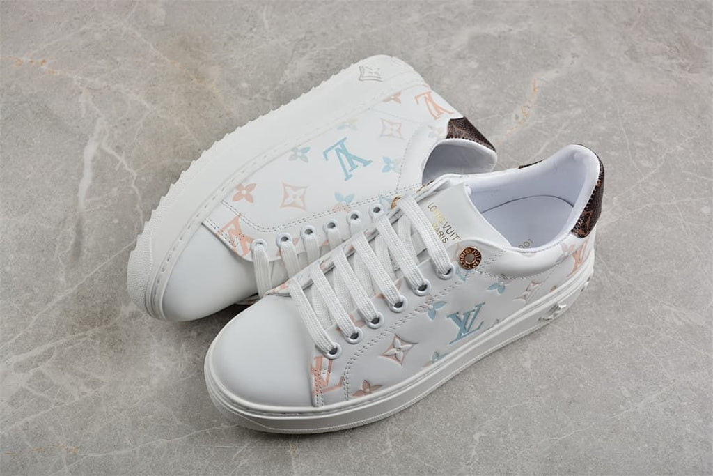 Pair of white low-top platform sneakers with multicolor pattern
