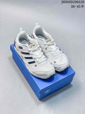 Pair of white Adidas Originals S.F.T.M. low-top sneakers with dark accents on a blue shoe box