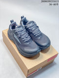 Pair of dark gray-blue Altra Timp 5 trail shoes shown from above on a box