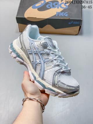 Three-quarter front view showing the layered upper, light blue panels, laces, and pale midsole.
