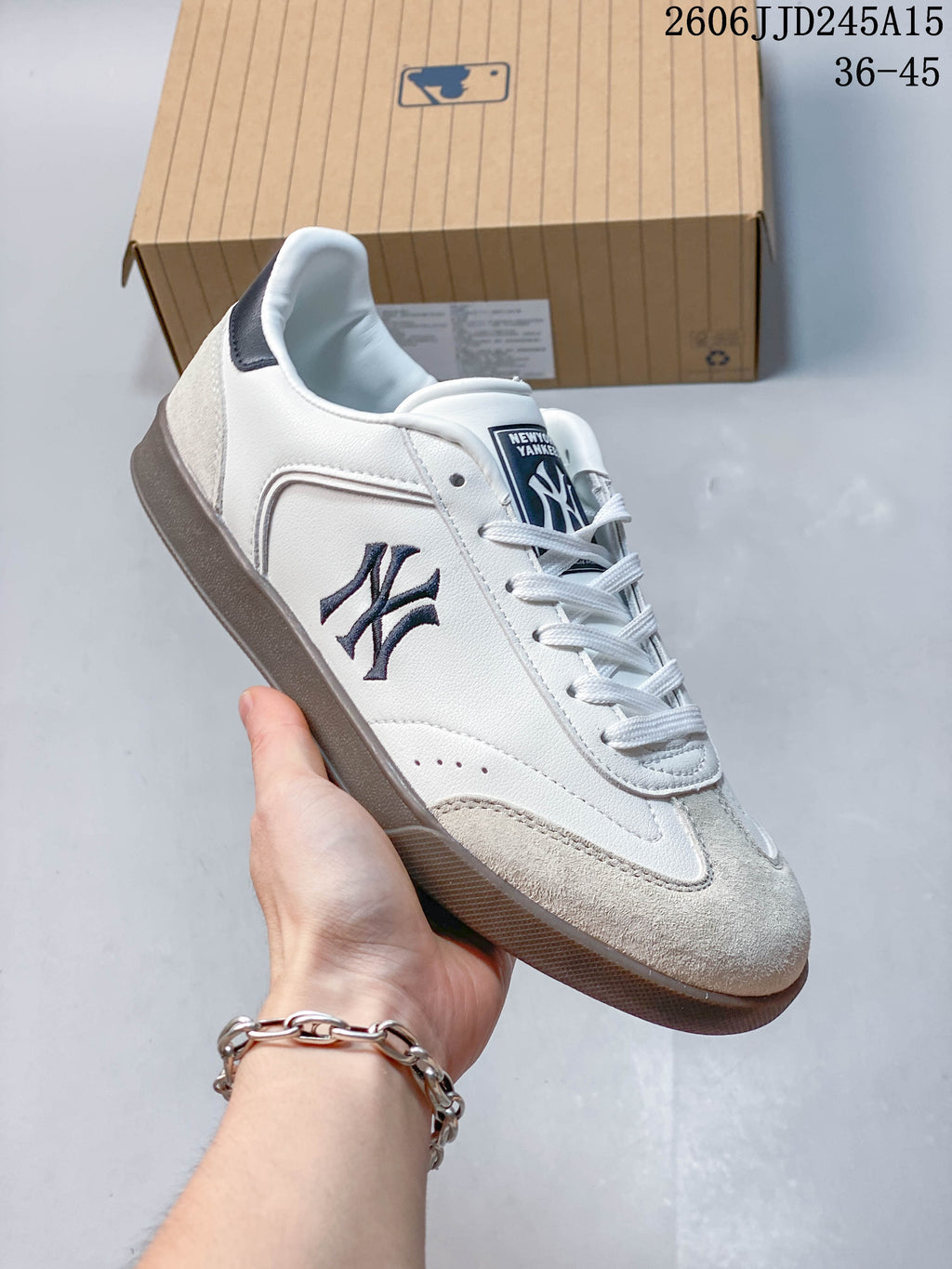 White, navy, and cream New York Yankees low-top sneaker