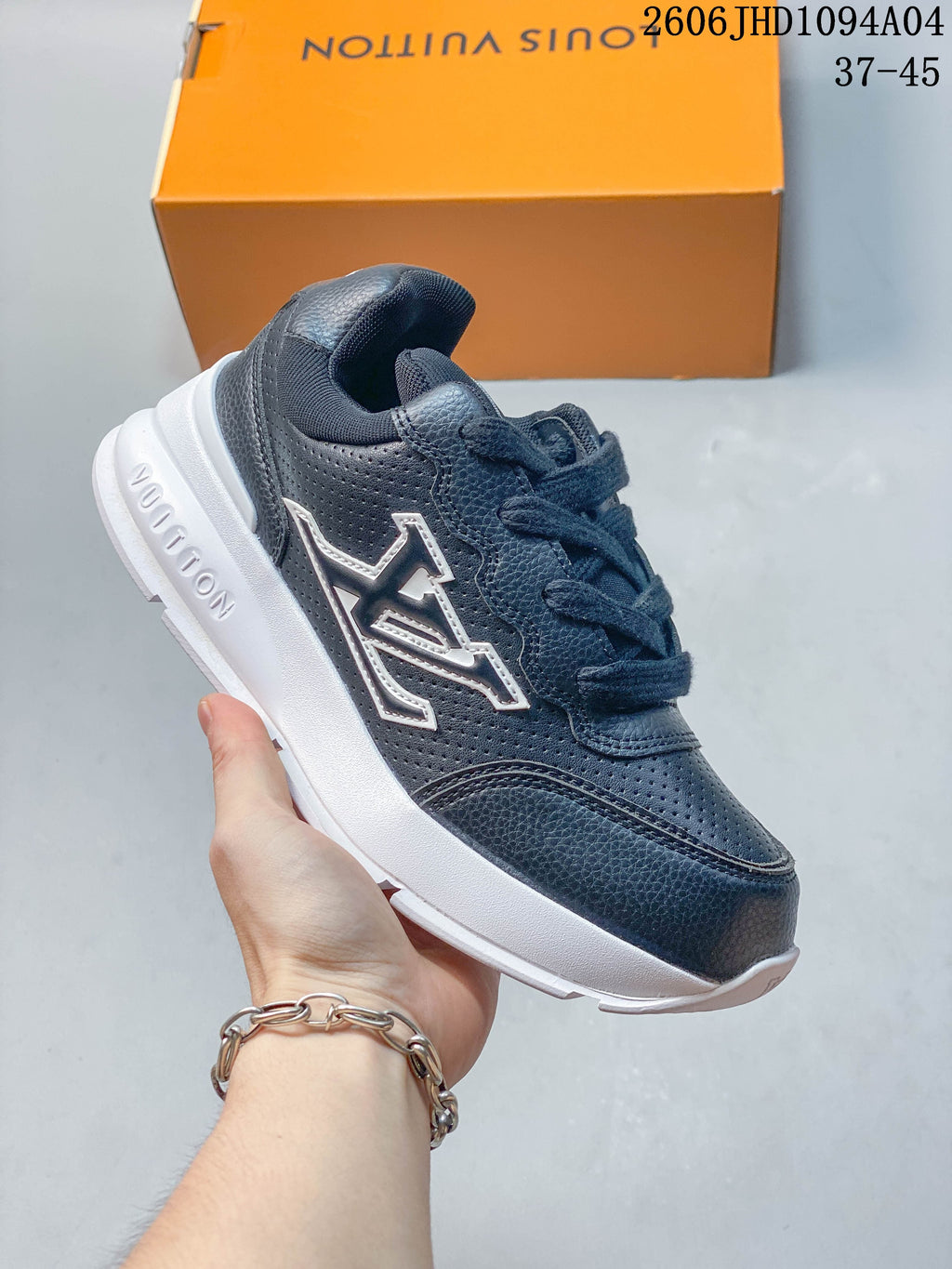 Dark blue-gray low-top Louis Vuitton Trainer sneaker with a white midsole